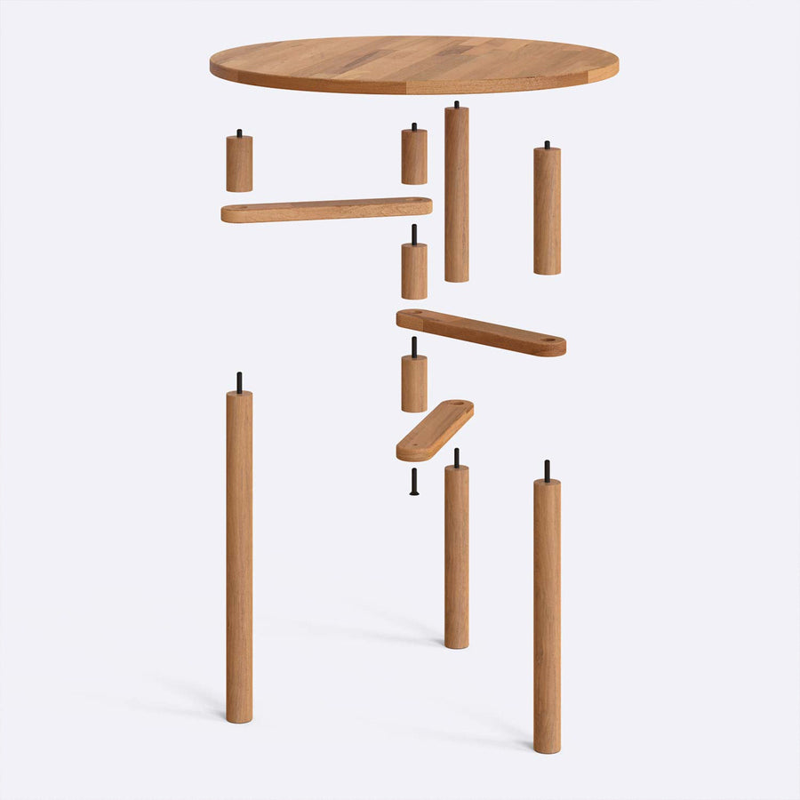 A full view of the dining area with the small round dining table at the center, highlighting the elegant wood finish and versatile design